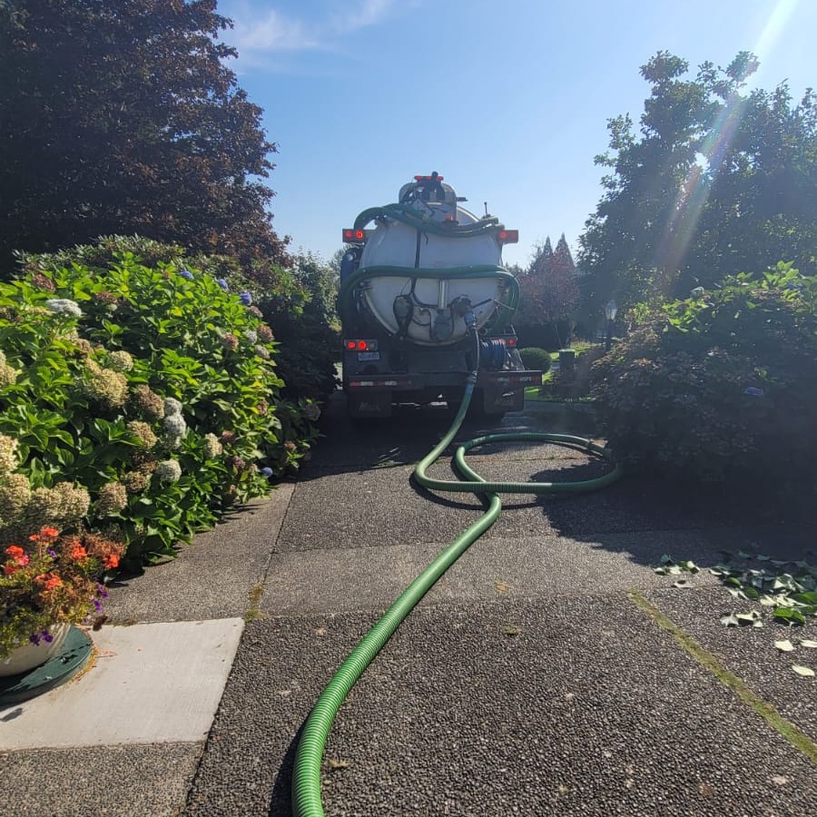 Clearset septic pumping truck parked on site for a residential pump-out visit.